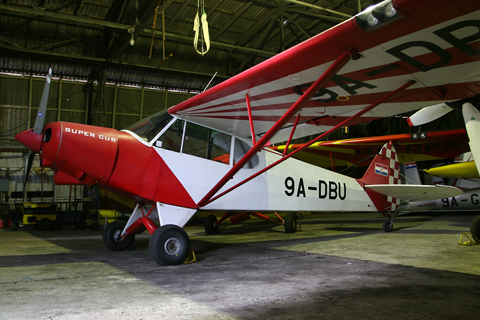 Despite it still being light outside - plenty of it between the storm clouds - we had lit up the interior as well :). A stock Super Cub, 9A-DBU is one of a number of such aircraft bought and imported at pretty much the same time for towing duties